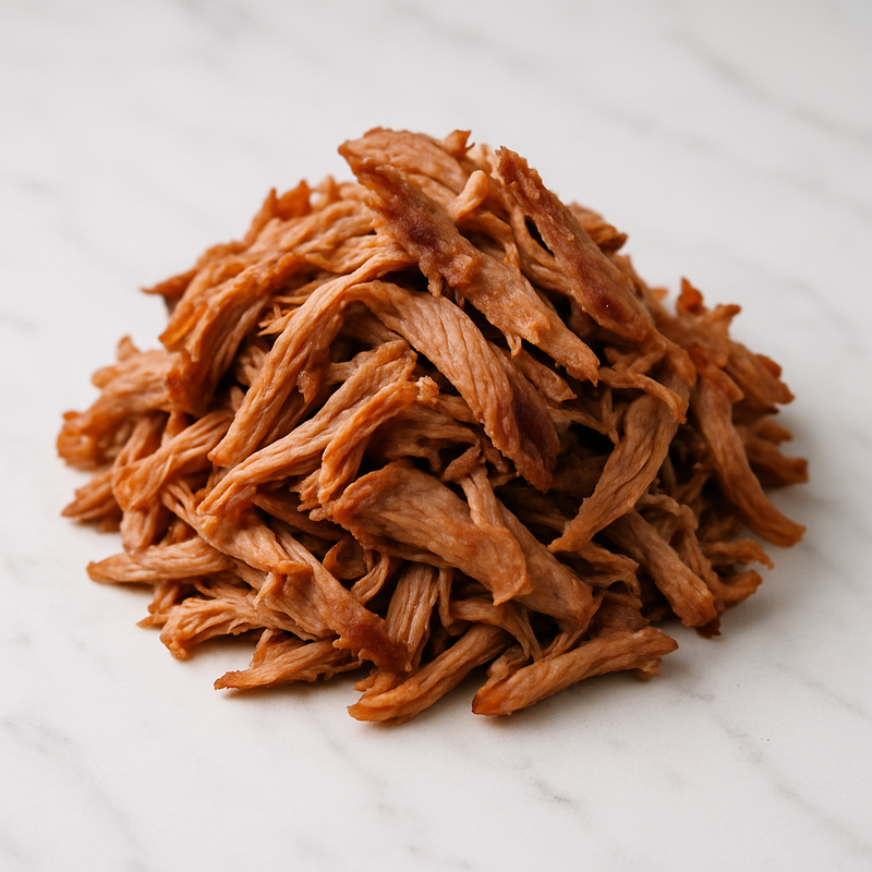 Pierna de cerdo cocida y deshebrada